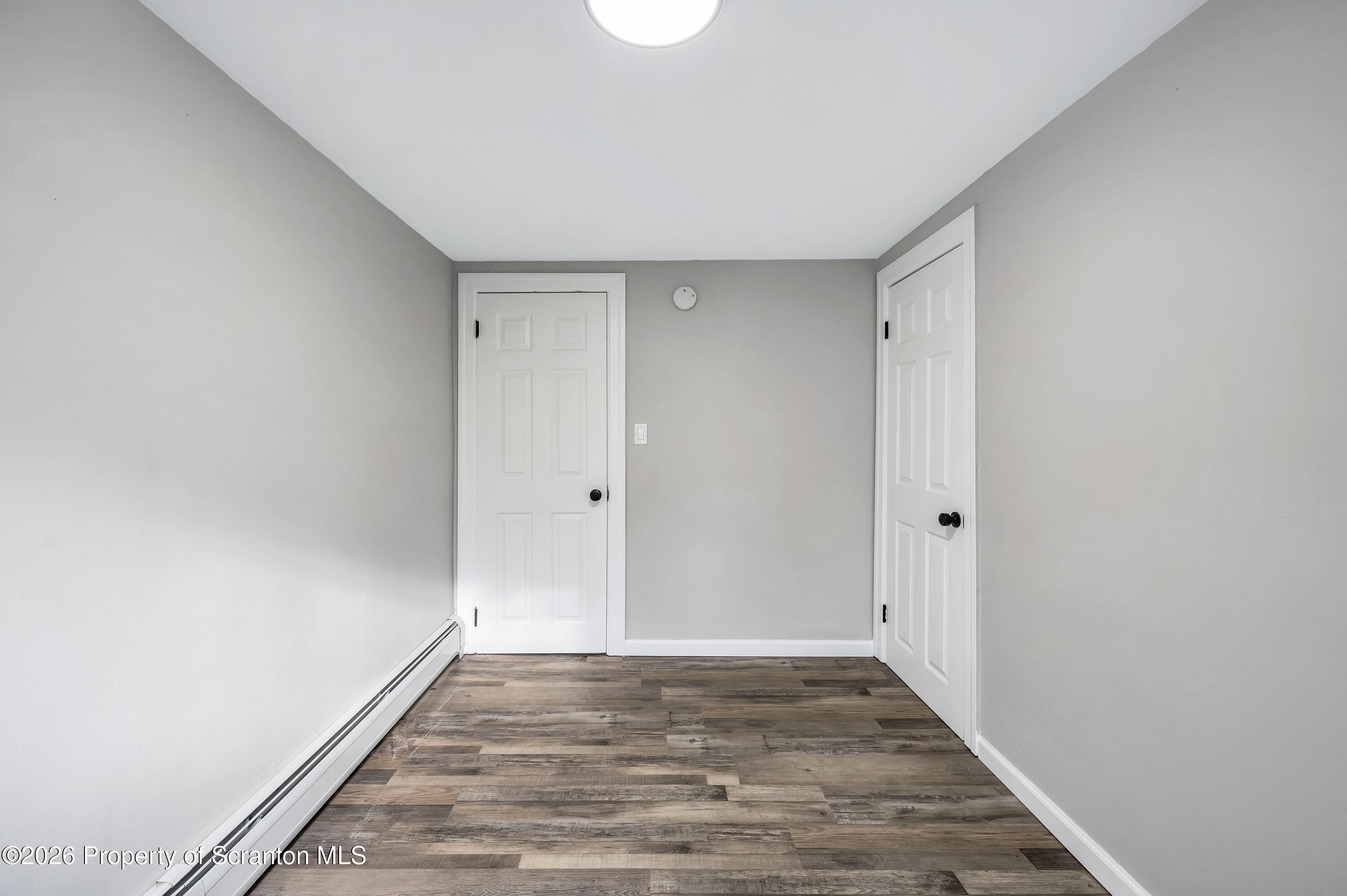 333 Oak Street, Unit 1/2 Scranton, PA 18508 - Photo 9 of 11 a view of an empty room and wooden floor