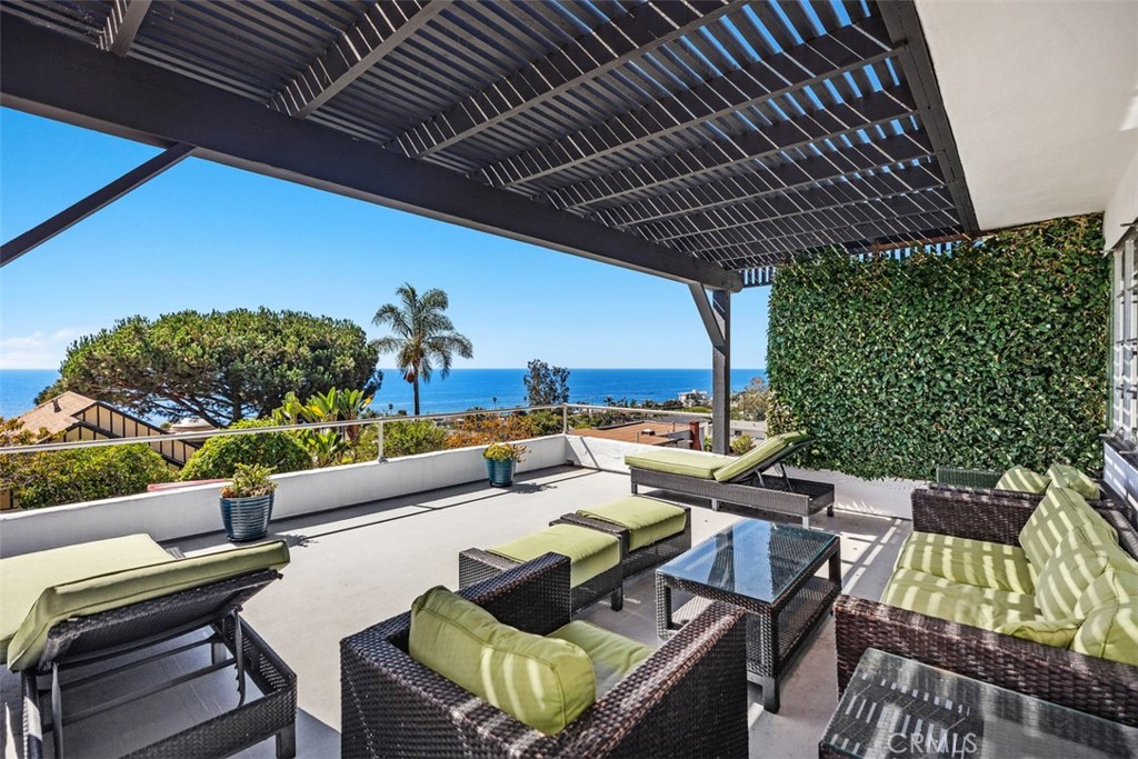 2142 Ruby Place Laguna Beach, CA 92651 - Photo 1 of 34 a roof deck with couches and potted plants