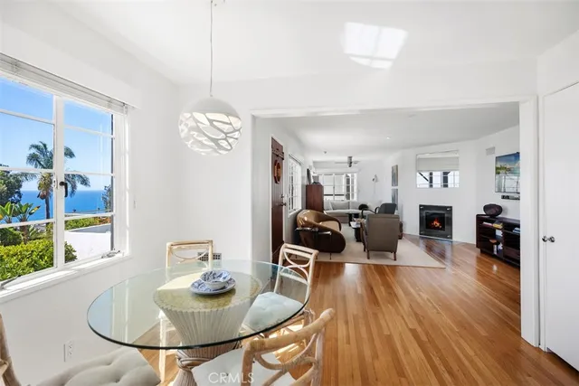 a living room with fireplace furniture and a wooden floor