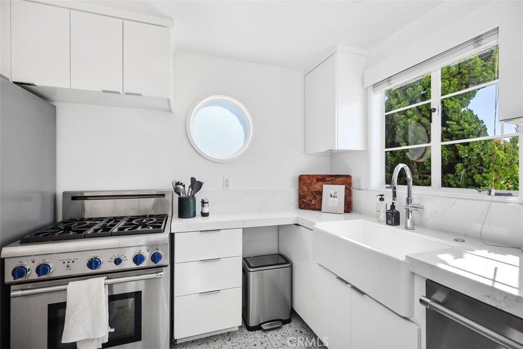 2142 Ruby Place Laguna Beach, CA 92651 - Photo 16 of 34 a kitchen with a stove and a sink