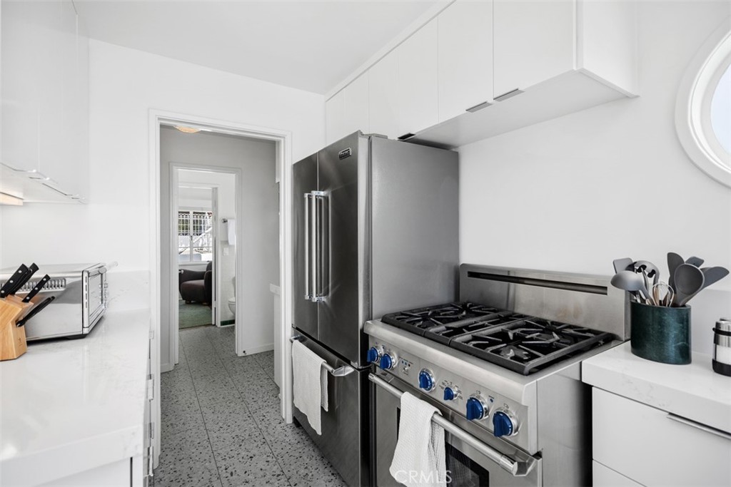 2142 Ruby Place Laguna Beach, CA 92651 - Photo 19 of 34 a kitchen with a stove and a refrigerator