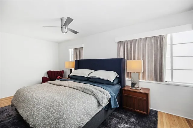 a bedroom with bed and window