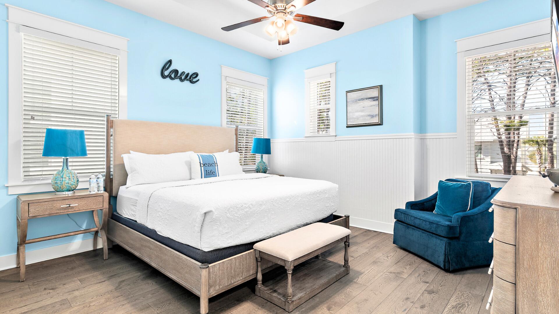 53 East E Pine, Unit A Inlet Beach, FL 32461 - Photo 17 of 59 a bedroom with a bed and wooden floor