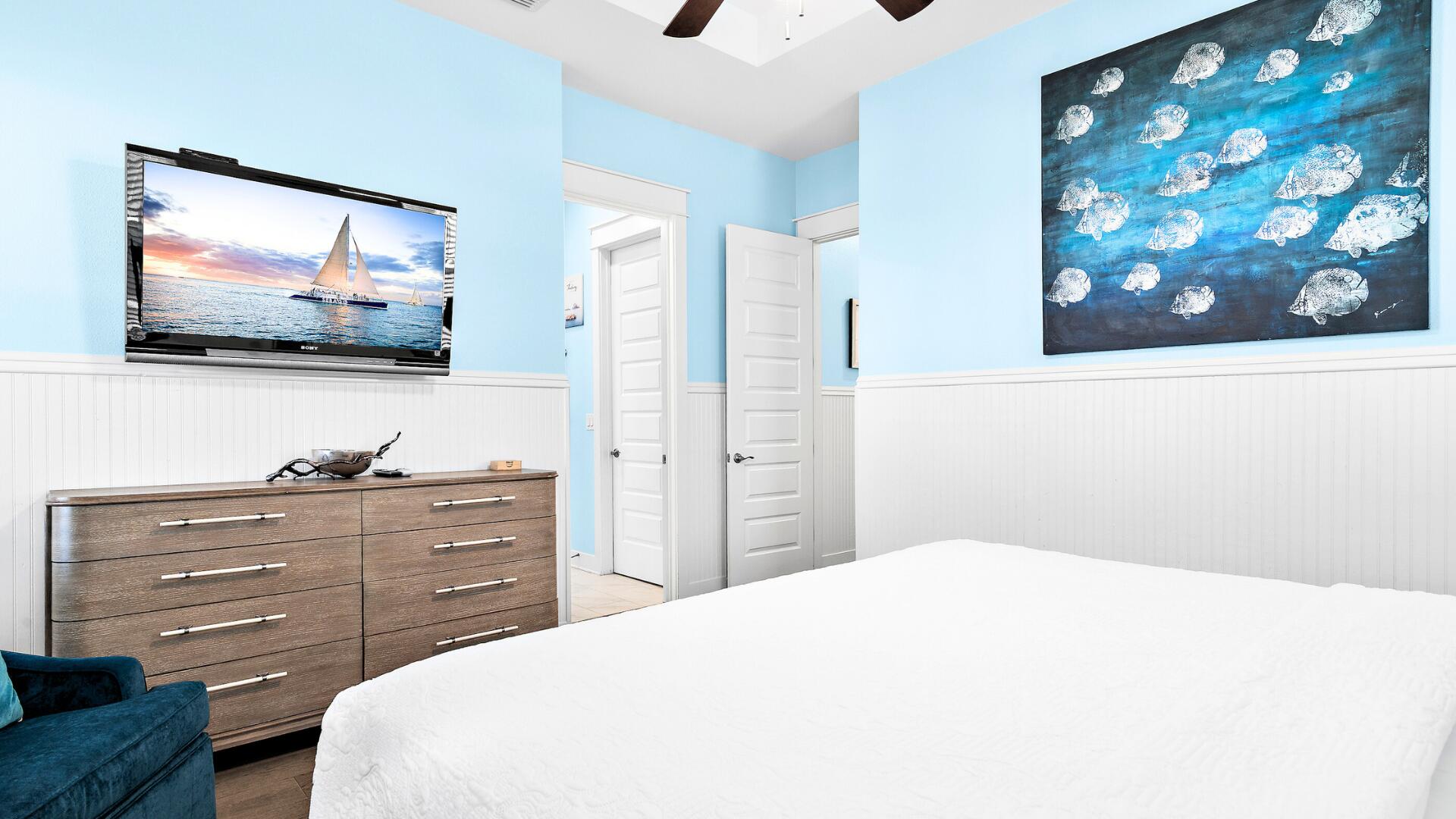 53 East E Pine, Unit A Inlet Beach, FL 32461 - Photo 18 of 59 a bedroom with a bed and a flat screen tv