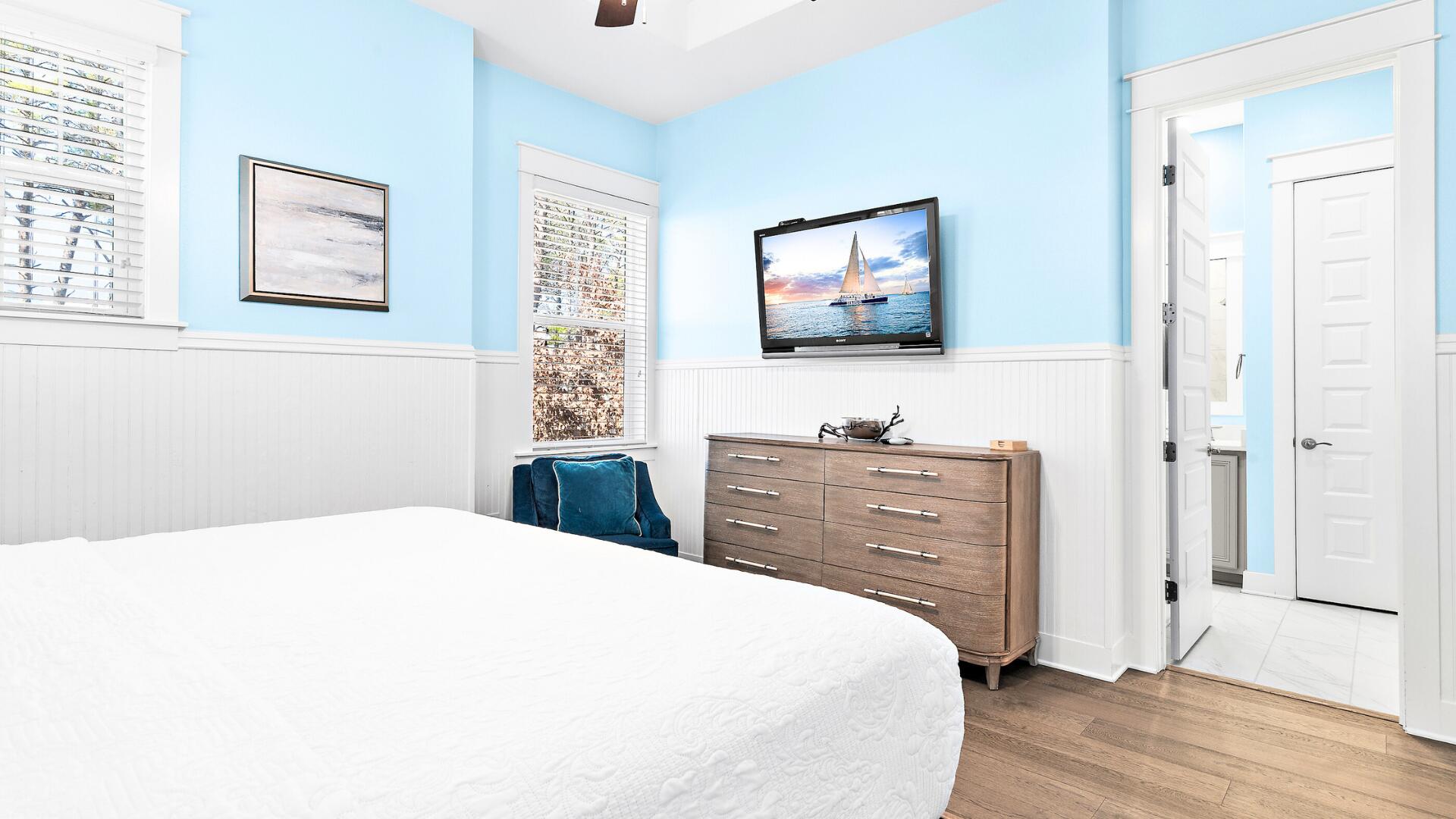 53 East E Pine, Unit A Inlet Beach, FL 32461 - Photo 19 of 59 a bedroom with a bed and a flat screen tv