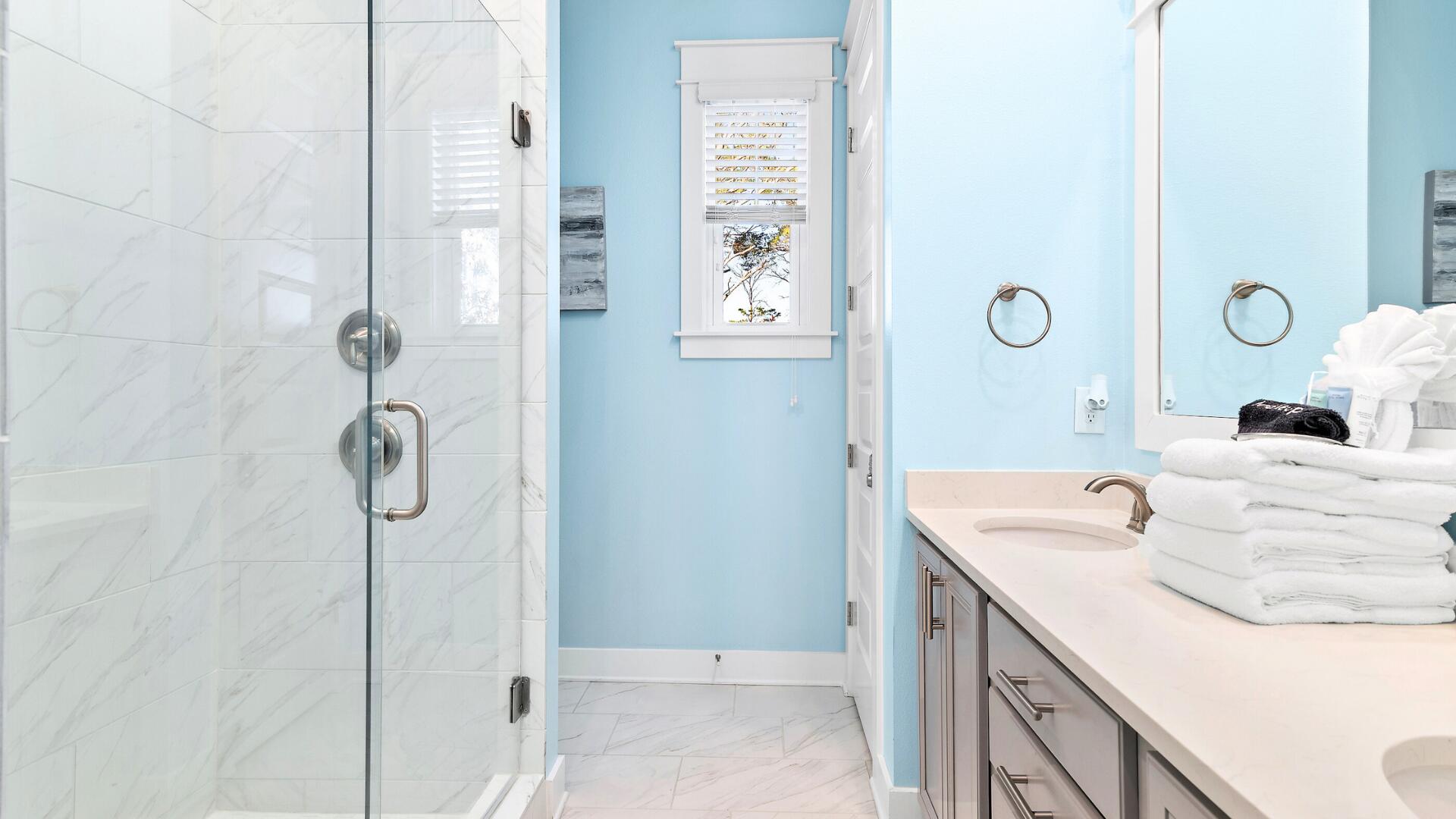 53 East E Pine, Unit A Inlet Beach, FL 32461 - Photo 20 of 59 a bathroom with a sink a mirror and shower