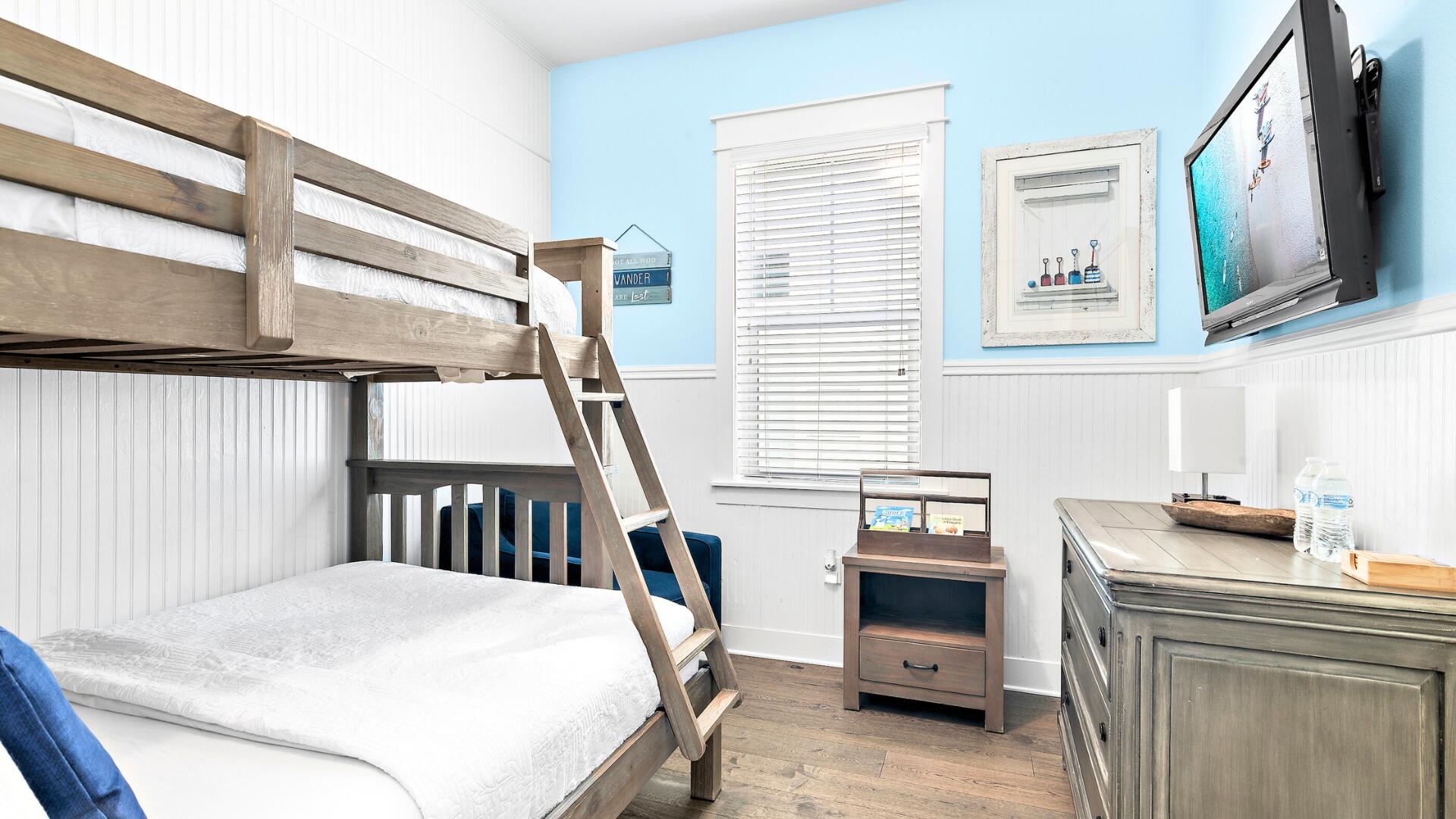 53 East E Pine, Unit A Inlet Beach, FL 32461 - Photo 23 of 59 a bedroom with a bed and a tv in it