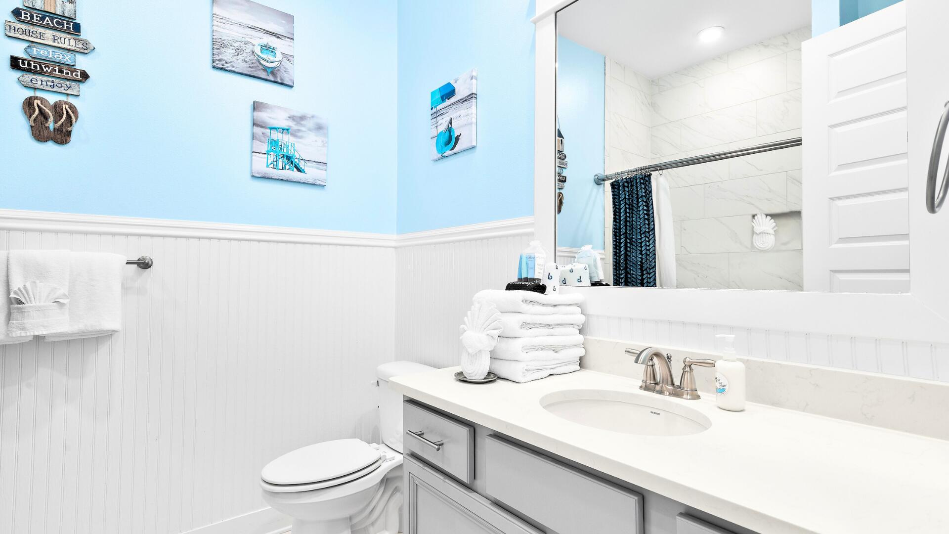 53 East E Pine, Unit A Inlet Beach, FL 32461 - Photo 26 of 59 a bathroom with a sink a toilet and a mirror