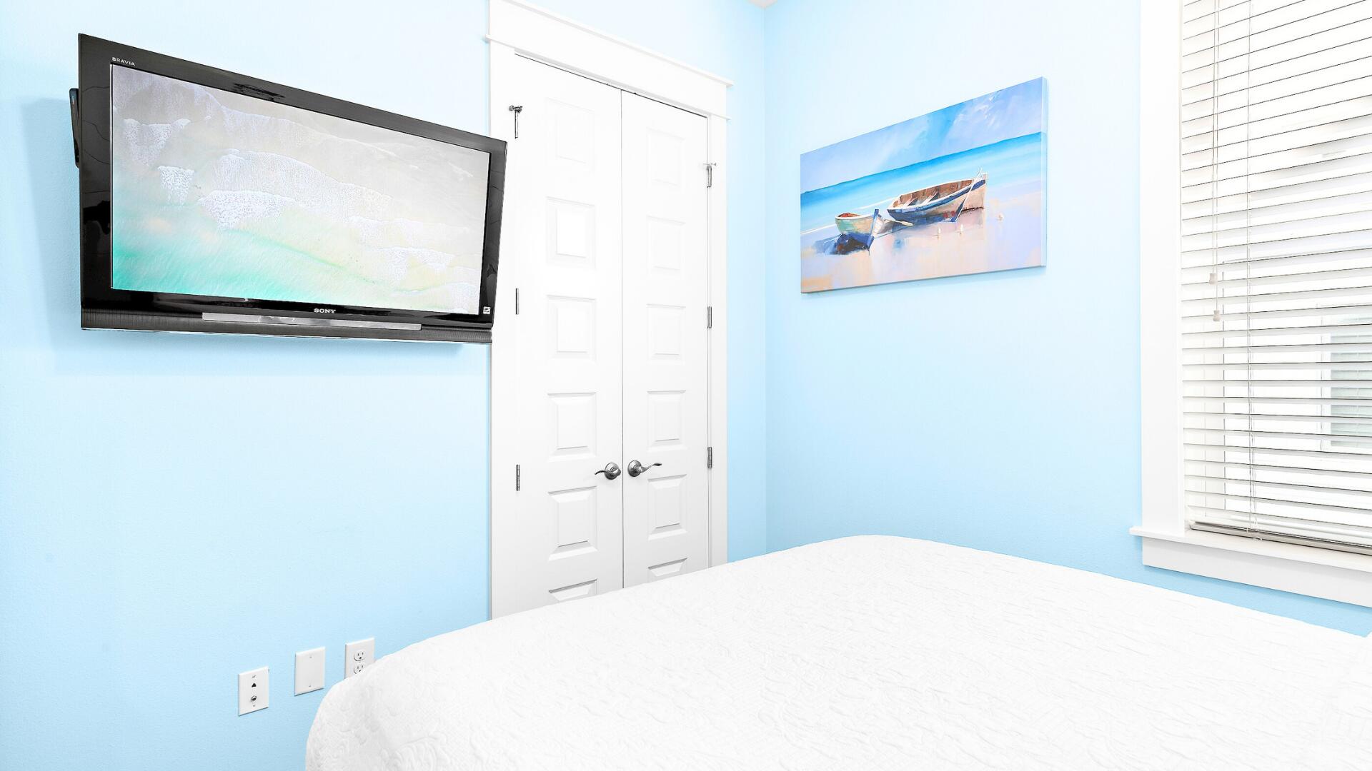 53 East E Pine, Unit A Inlet Beach, FL 32461 - Photo 30 of 59 a bedroom with a bed and a flat screen tv