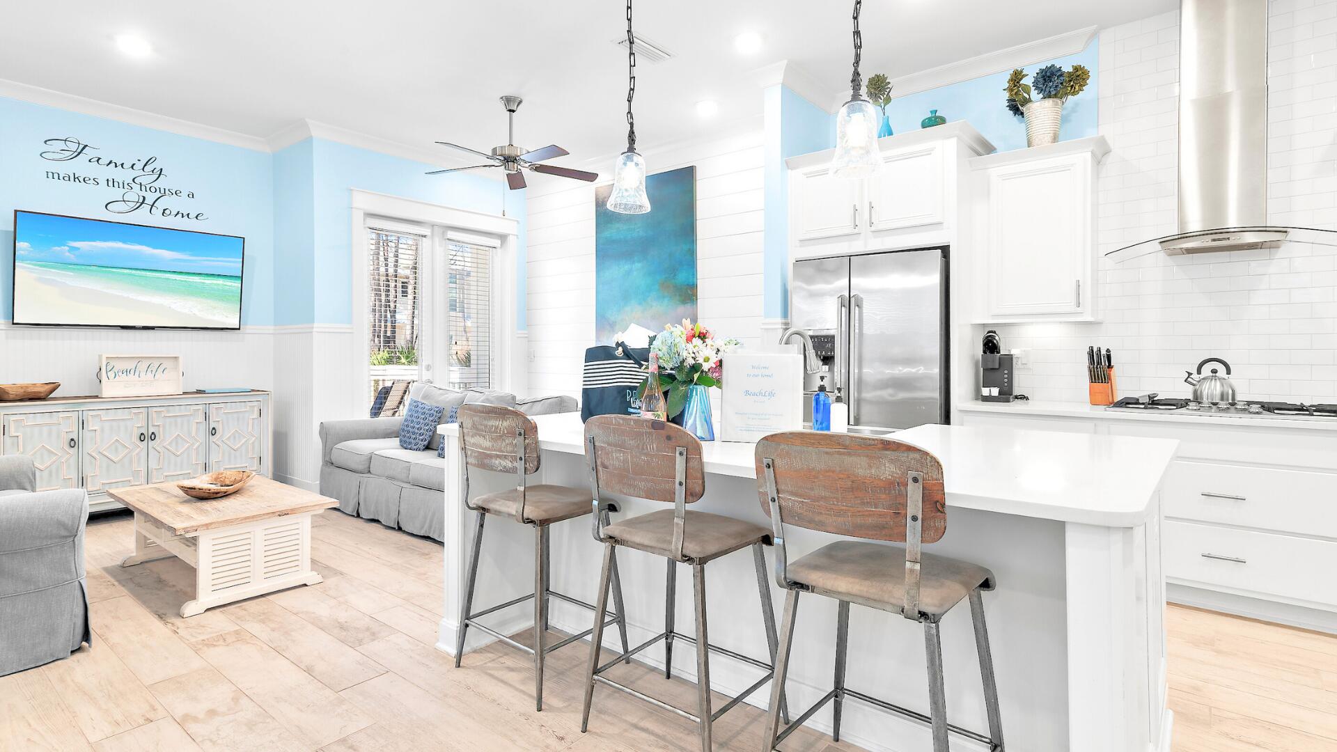 53 East E Pine, Unit A Inlet Beach, FL 32461 - Photo 3 of 59 a living room with furniture and a chandelier