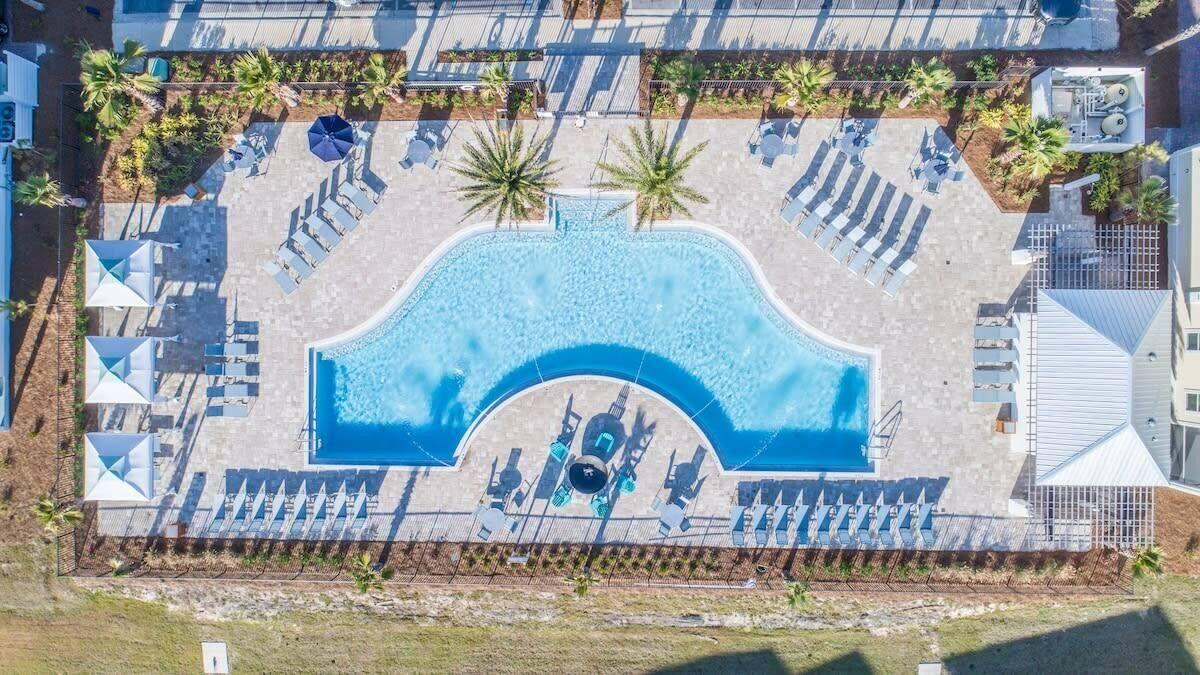 53 East E Pine, Unit A Inlet Beach, FL 32461 - Photo 39 of 59 a view of swimming pool with outdoor seating and plants