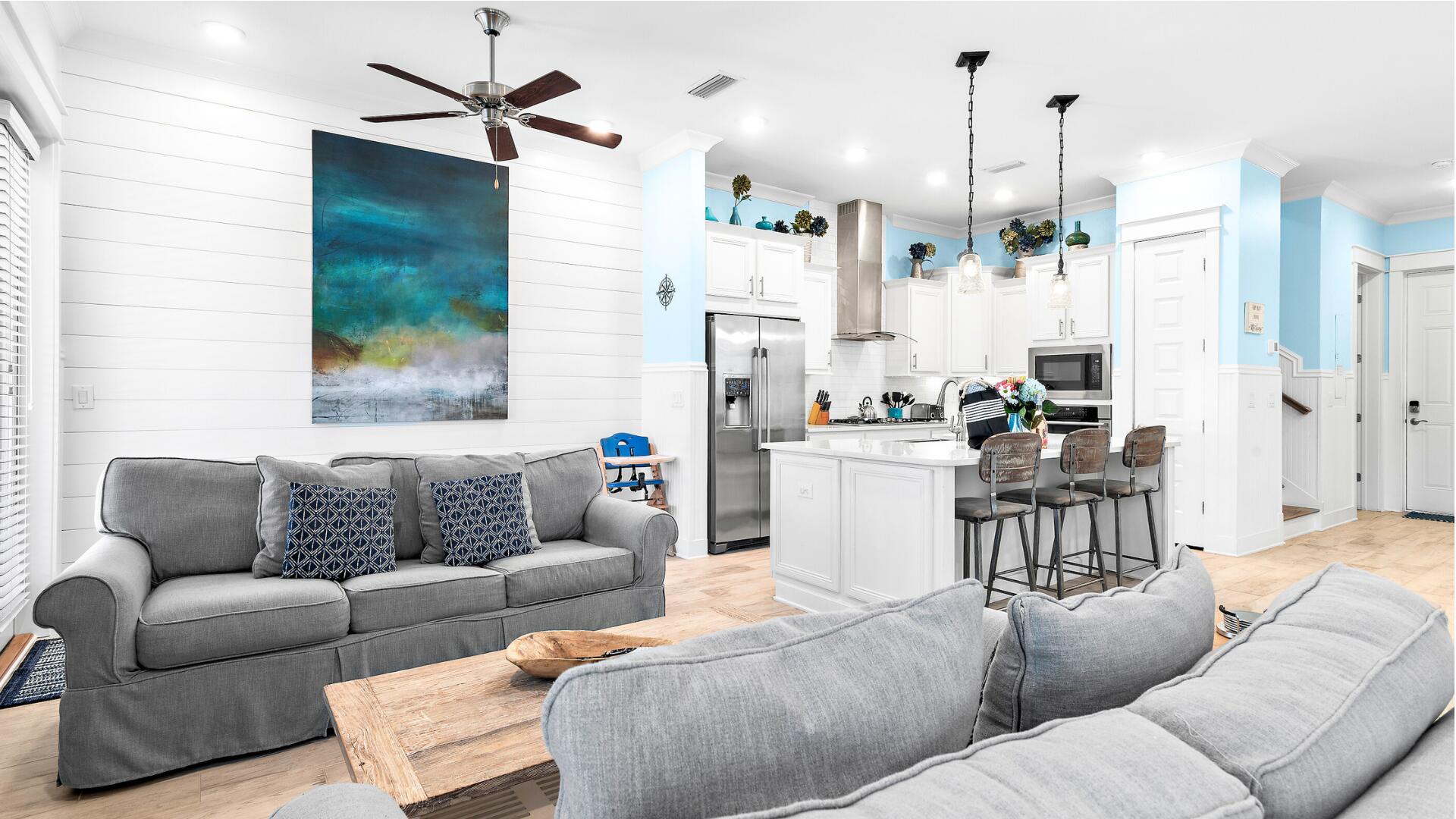 53 East E Pine, Unit A Inlet Beach, FL 32461 - Photo 6 of 59 a living room with furniture and a chandelier