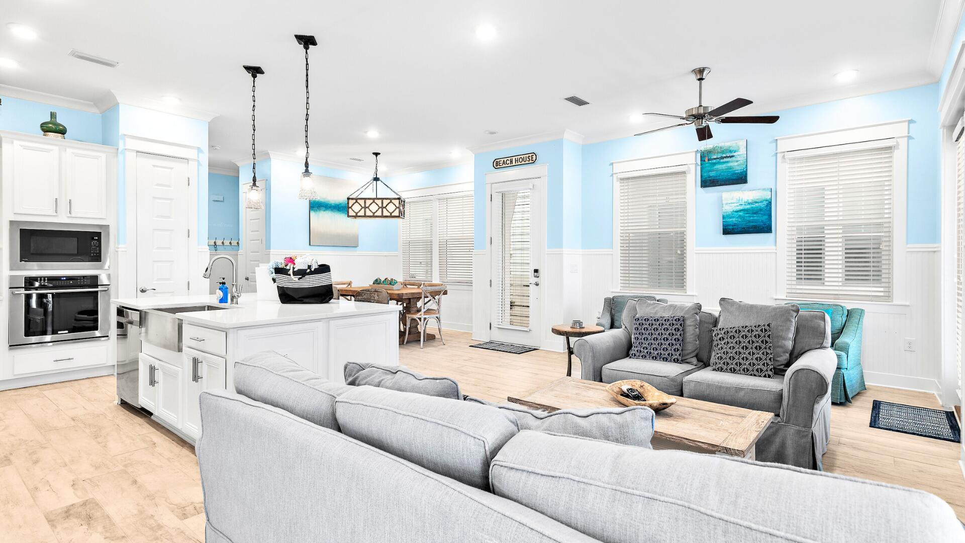 53 East E Pine, Unit A Inlet Beach, FL 32461 - Photo 8 of 59 a living room with furniture kitchen view and a chandelier