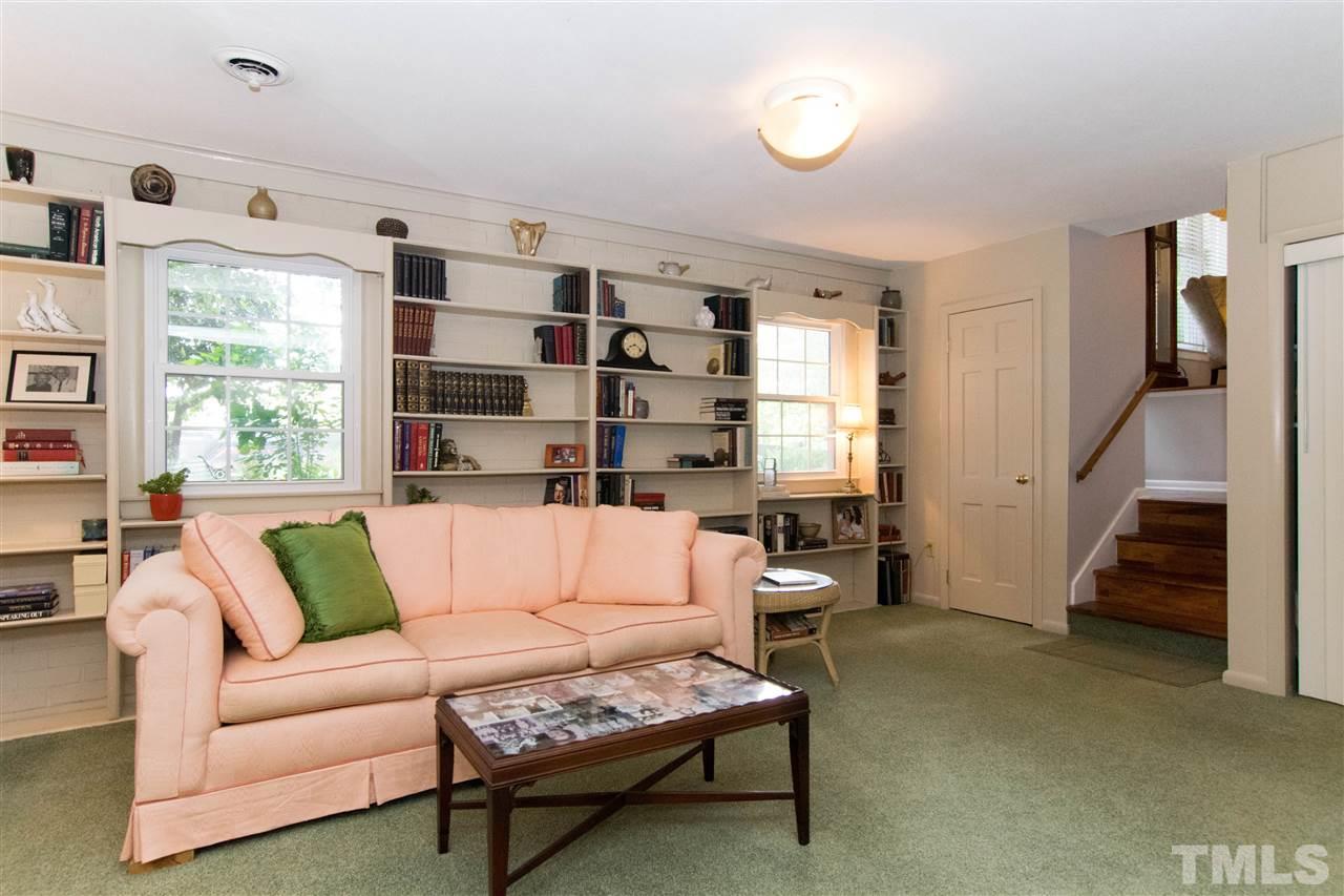 4708 Rampart Street Raleigh, NC 27609 - Photo 13 of 25 a living room with furniture and a large window