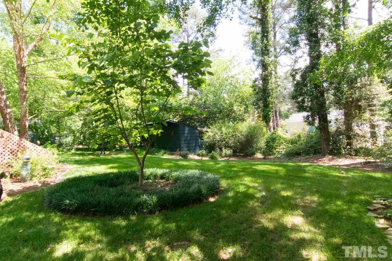 4708 Rampart Street Raleigh, NC 27609 - Photo 23 of 25 a view of a backyard with large trees
