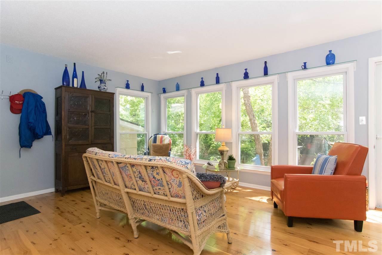 4708 Rampart Street Raleigh, NC 27609 - Photo 10 of 25 a living room with furniture and a large window