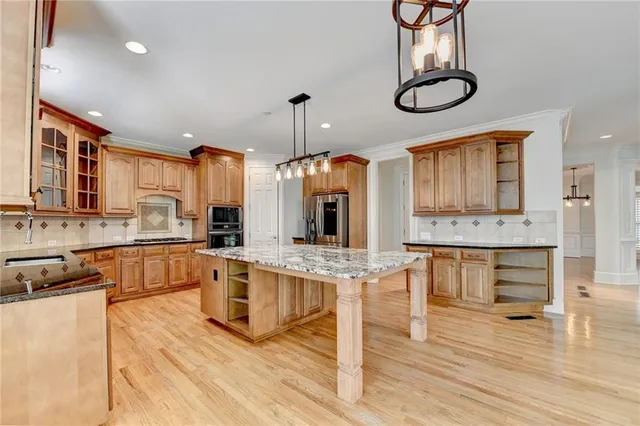 a view of an empty room with a ceiling fan