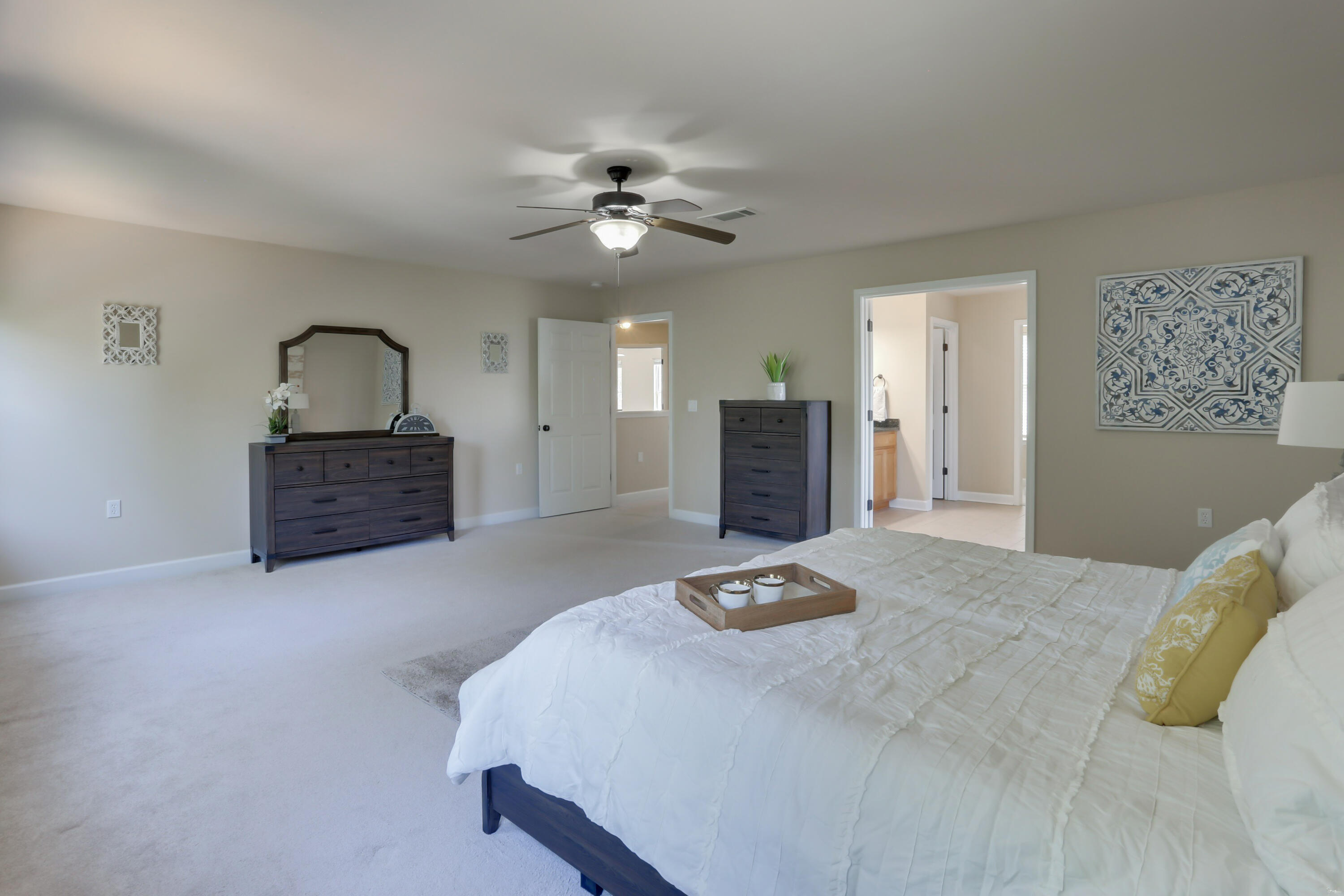 4581 Hermosa Road Crestview, FL 32539 - Photo 28 of 60 a bedroom with a bed and dresser