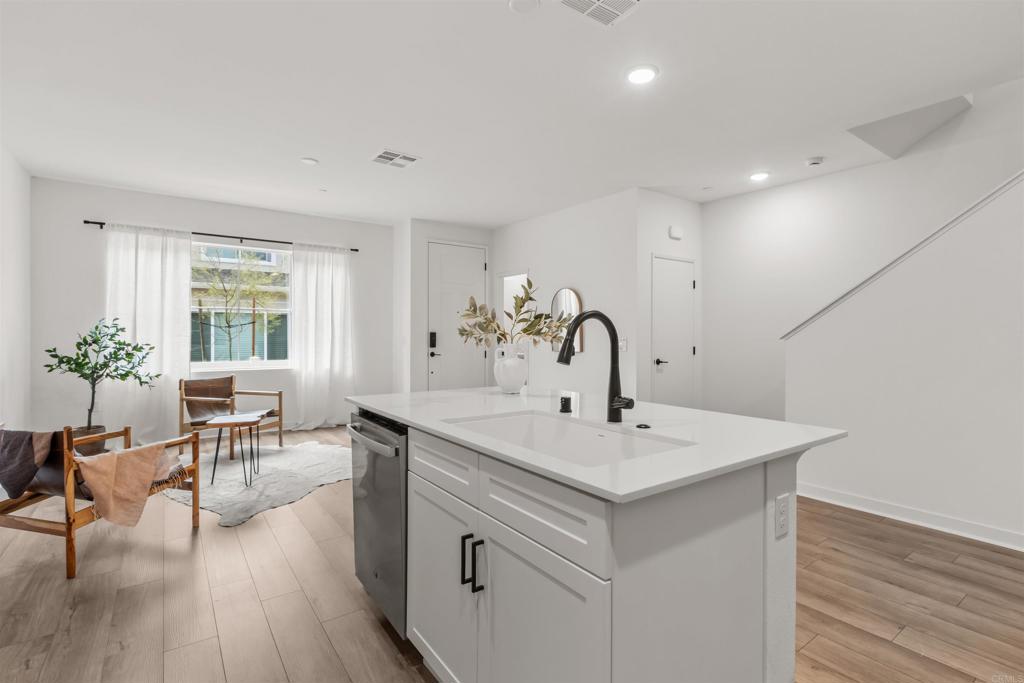 319 Minneola Place Fallbrook, CA 92028 - Photo 15 of 19 a view of living room with granite countertop furniture and wooden floor