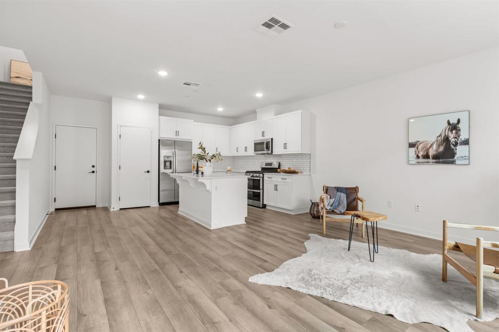 319 Minneola Place Fallbrook, CA 92028 - Photo 3 of 19 a view of kitchen with wooden floor and chairs