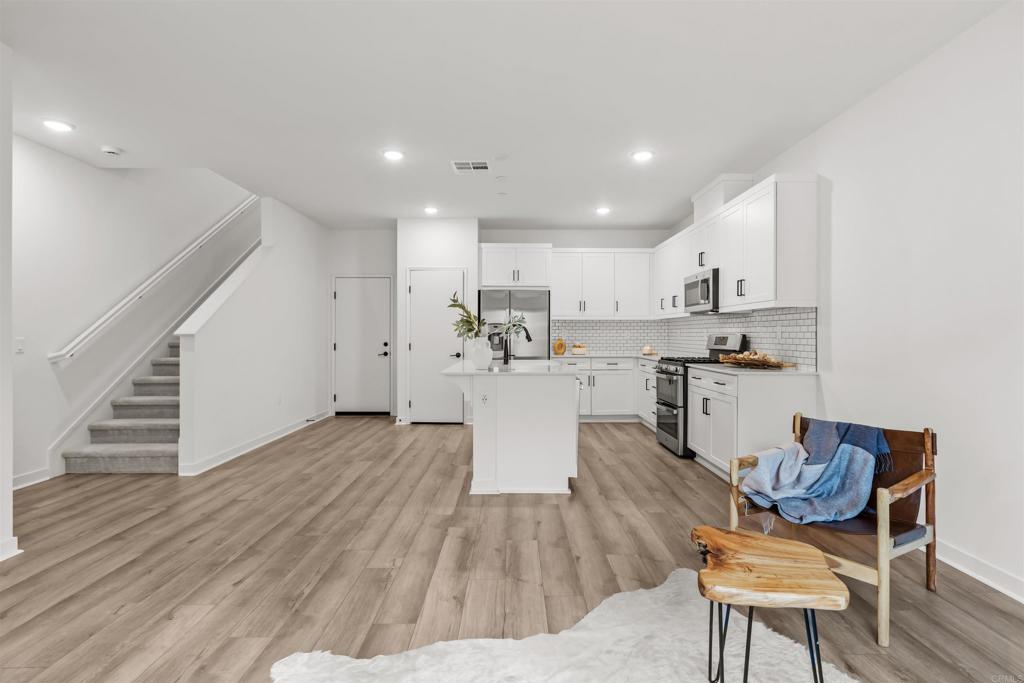 319 Minneola Place Fallbrook, CA 92028 - Photo 8 of 19 a view of kitchen with cabinets and wooden floor