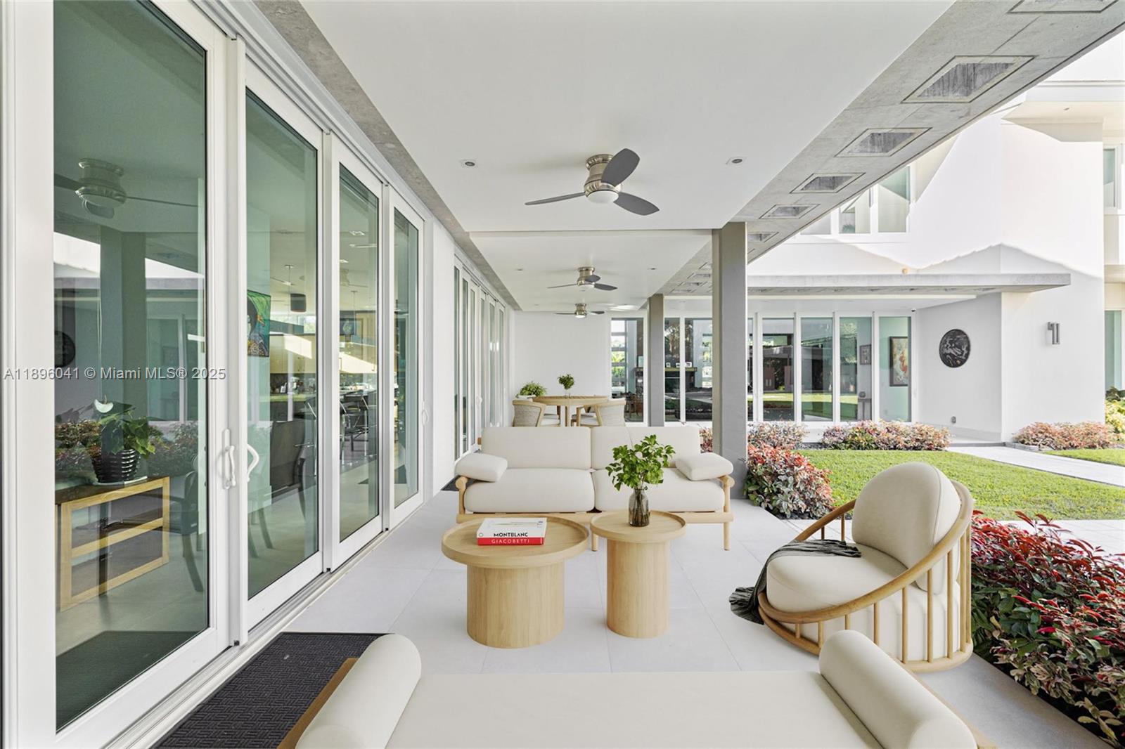 6080 Southwest 88th Street Pinecrest, FL 33156 - Photo 19 of 29 a view of a patio with swimming pool and furniture