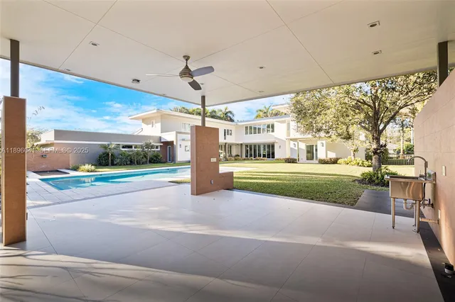 a view of a house with a porch and a yard