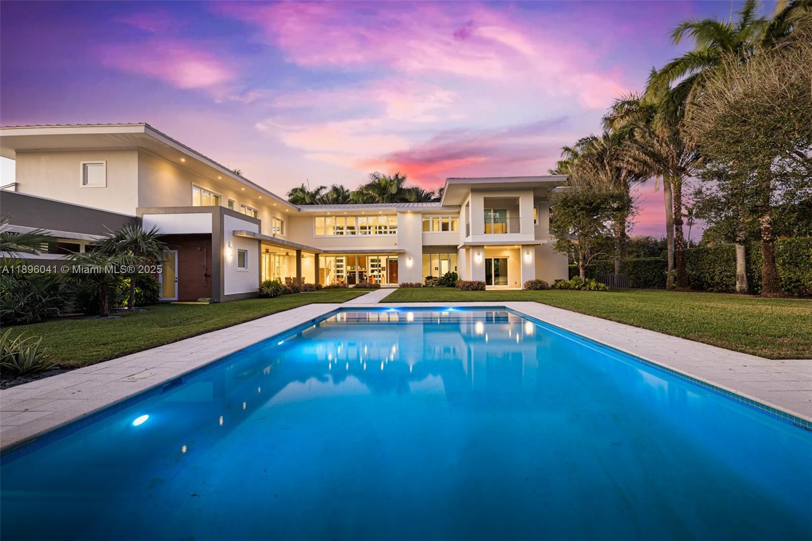 6080 Southwest 88th Street Pinecrest, FL 33156 - Photo 23 of 29 a swimming pool with outdoor seating and yard