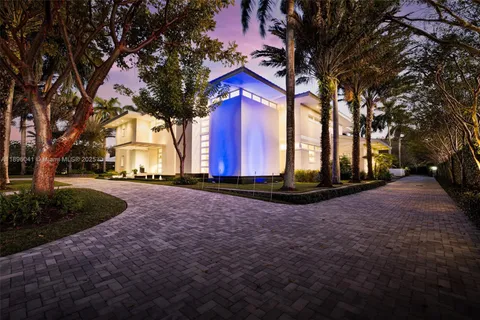 an aerial view of a house with garden space and street view