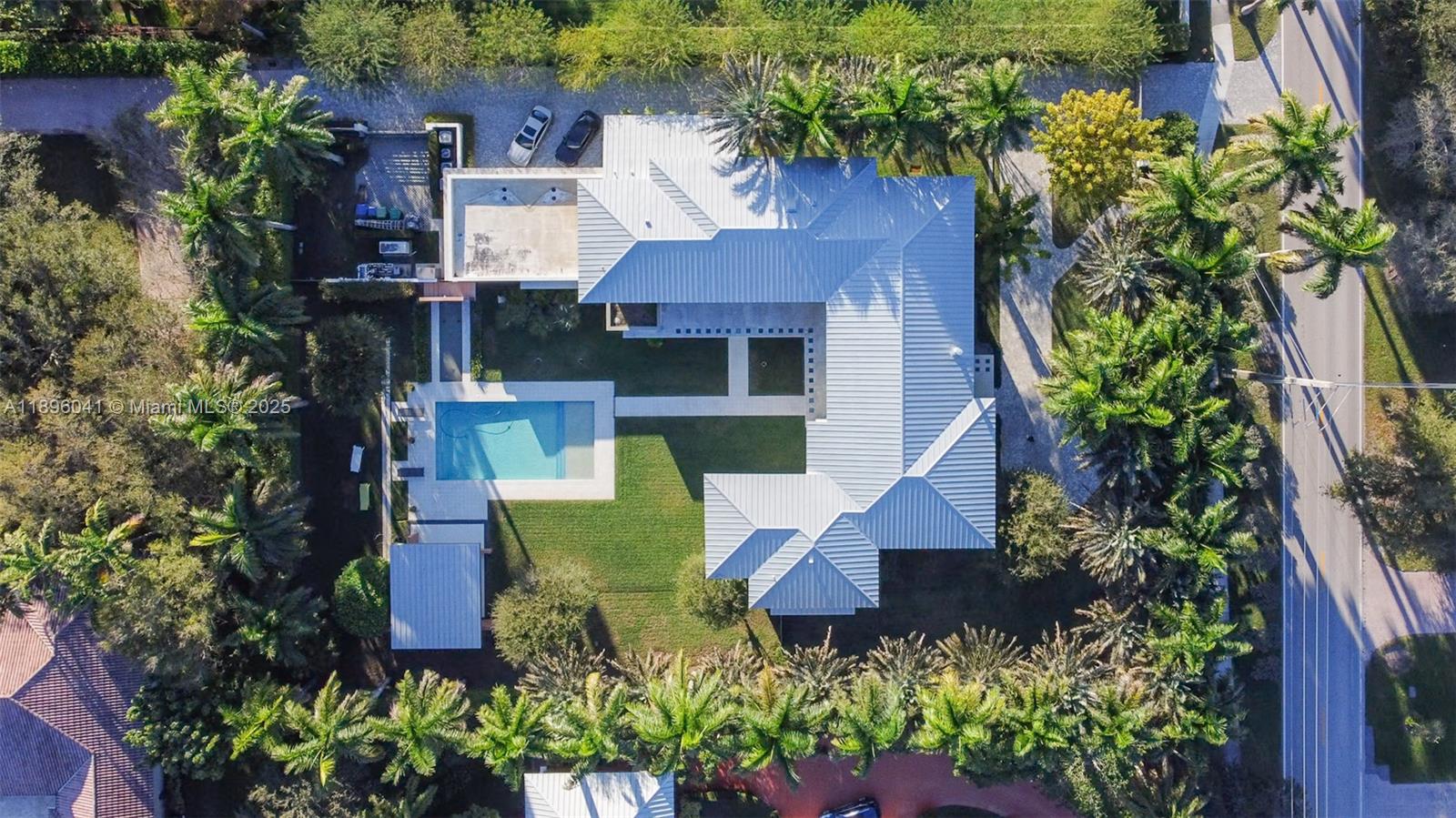6080 Southwest 88th Street Pinecrest, FL 33156 - Photo 28 of 29 an aerial view of a house with garden space and street view