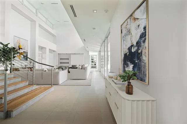 a view of entryway and hall with wooden floor
