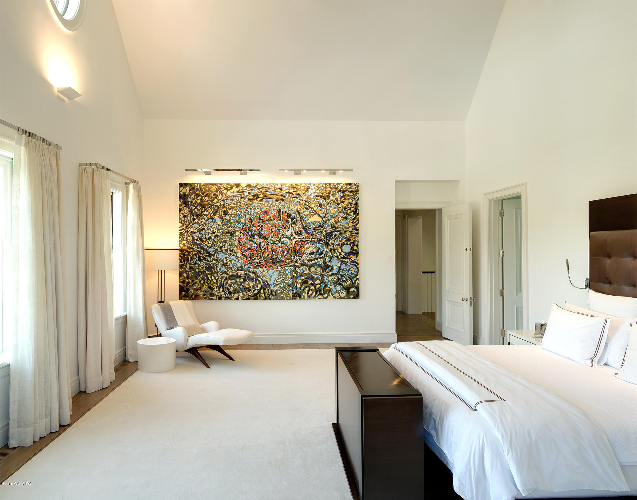 Undisclosed Address Greenwich, CT 06831 - Photo 16 of 23 a bedroom with a bed and a flat screen tv