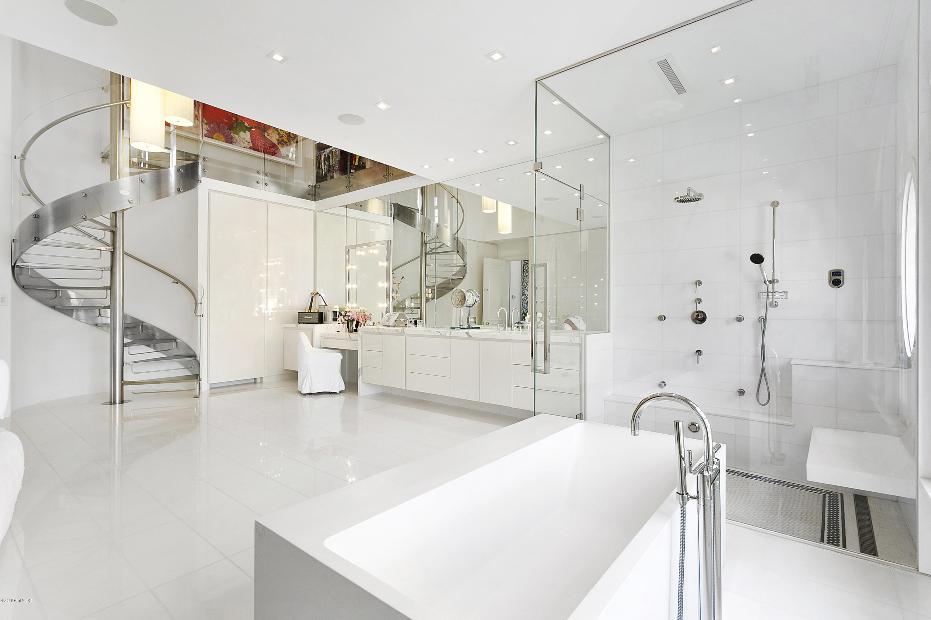 Undisclosed Address Greenwich, CT 06831 - Photo 17 of 23 a spacious bathroom with a double vanity sink a mirror and shower