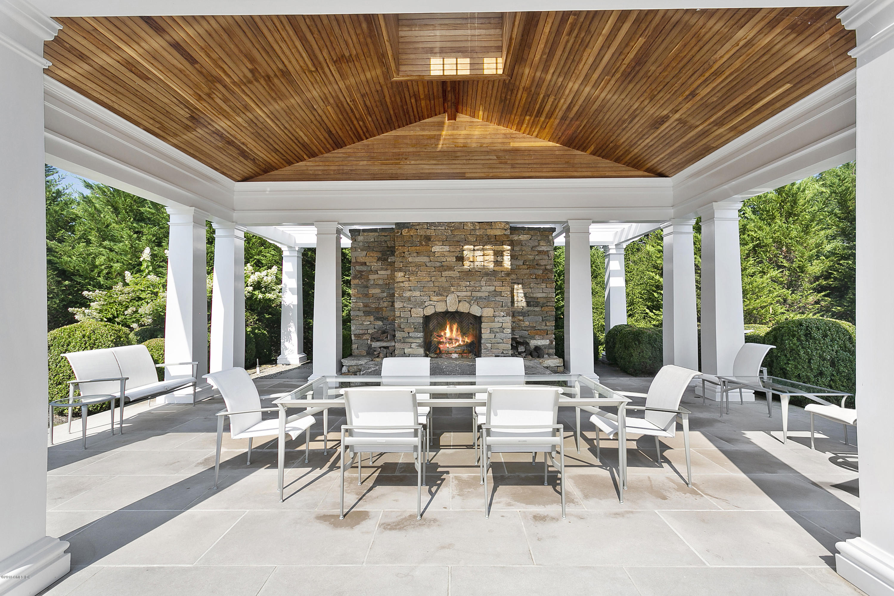 Undisclosed Address Greenwich, CT 06831 - Photo 22 of 23 a living room with patio furniture and a large window
