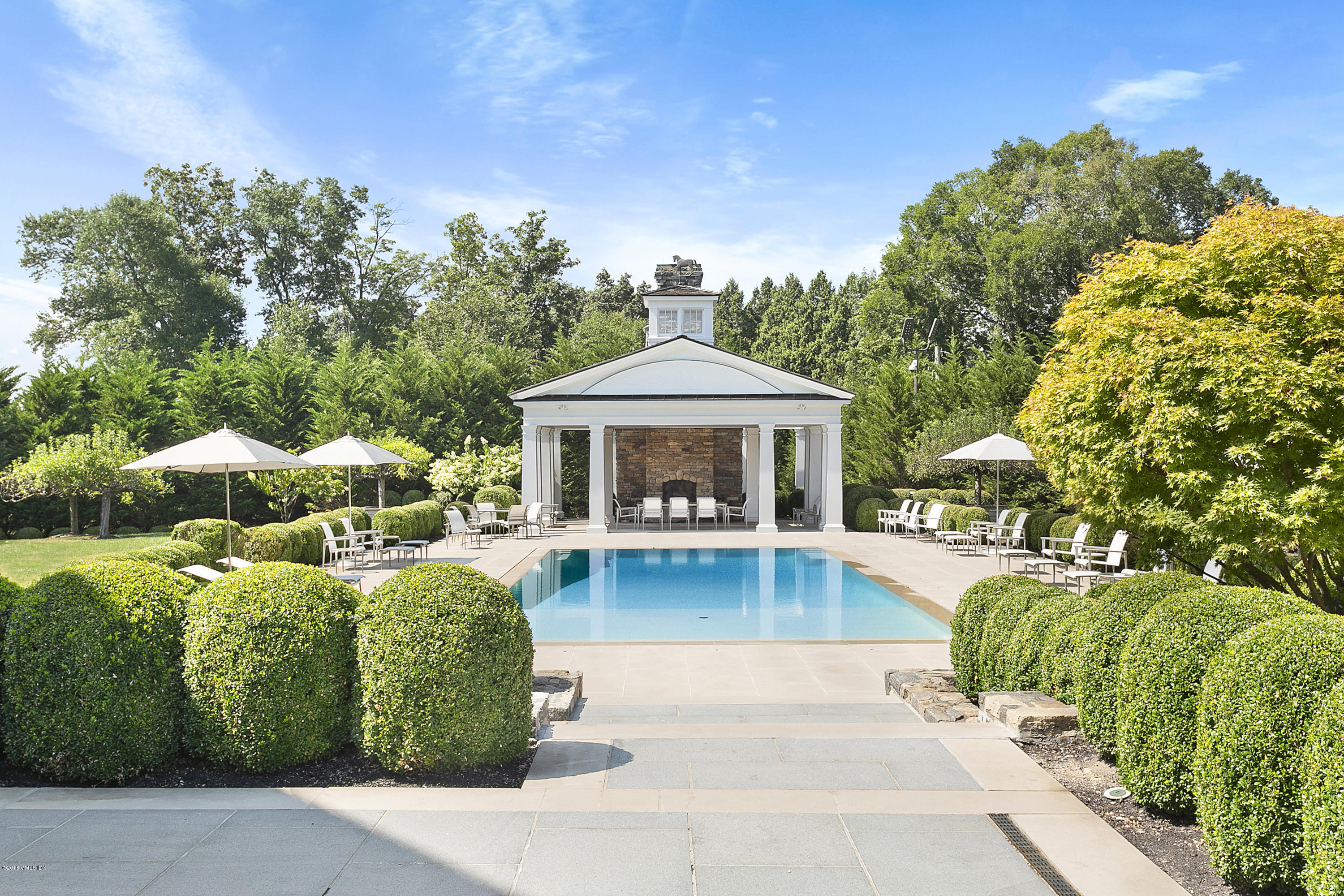 Undisclosed Address Greenwich, CT 06831 - Photo 4 of 23 a front view of a house with garden