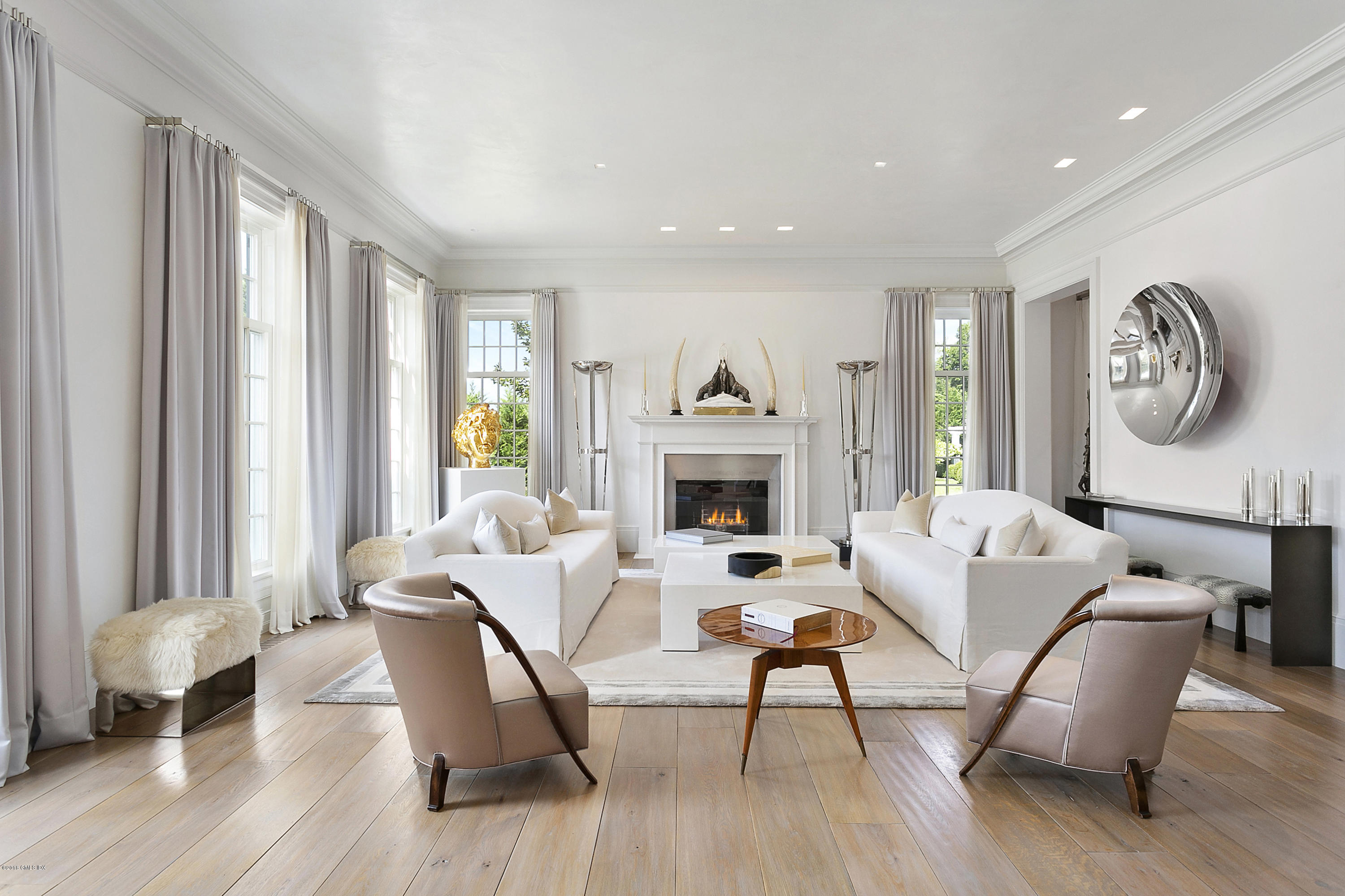 Undisclosed Address Greenwich, CT 06831 - Photo 5 of 23 a living room with furniture and a fireplace