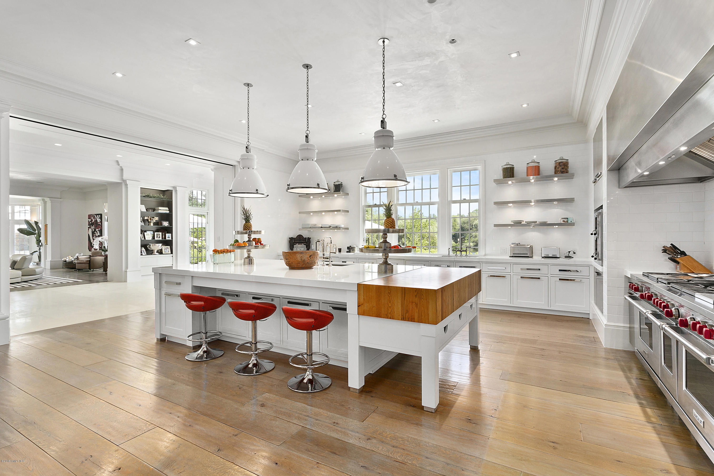 Undisclosed Address Greenwich, CT 06831 - Photo 8 of 23 a kitchen with stainless steel appliances a stove a sink and a refrigerator