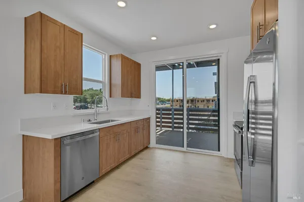 a kitchen with a refrigerator stove and microwave