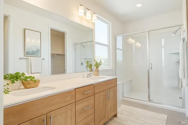 a kitchen with a refrigerator and a white cabinets