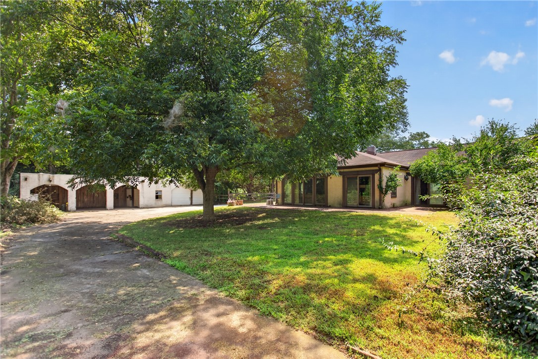 1719 Old Central Road Central, SC 29630 - Photo 9 of 45 Mature trees shade the spacious lawn of this secluded single-level home.