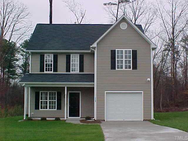 1113 Kavkaz Street Raleigh, NC 27610 - Photo 1 of 1 a front view of a house with a garden and yard