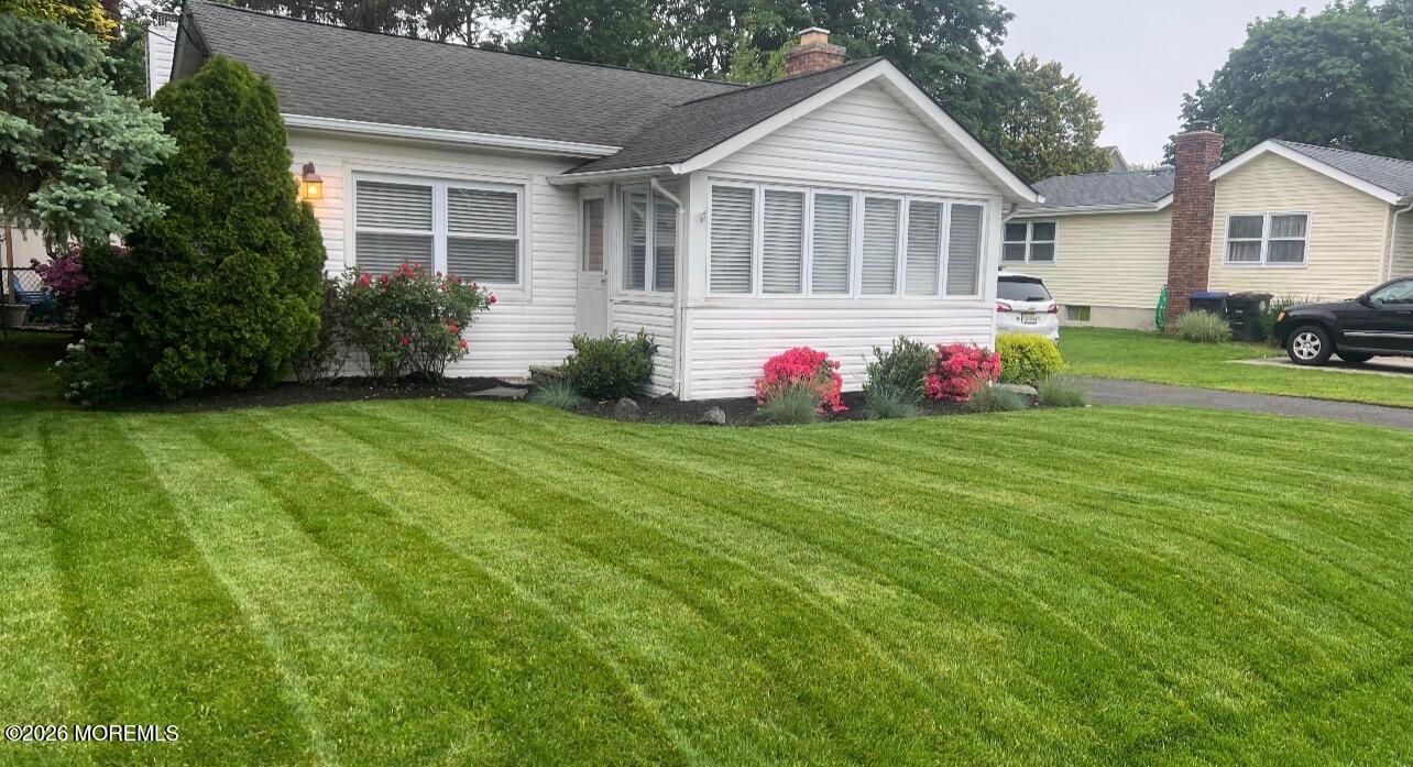 1406 Edgemere Road Wall, NJ 07719 - Photo 4 of 34 a front view of house with yard and green space
