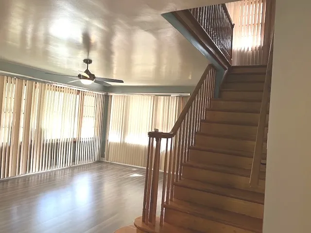 a view of an entryway with wooden floor