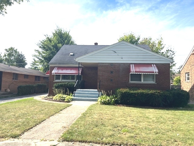 15240 Ashland Avenue Harvey, IL 60426 - Photo 3 of 27 a front view of a house with a yard