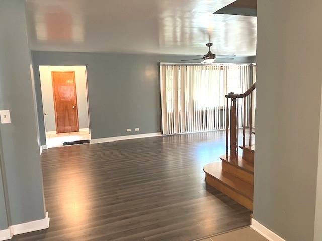 15240 Ashland Avenue Harvey, IL 60426 - Photo 9 of 27 wooden floor in an empty room with a window