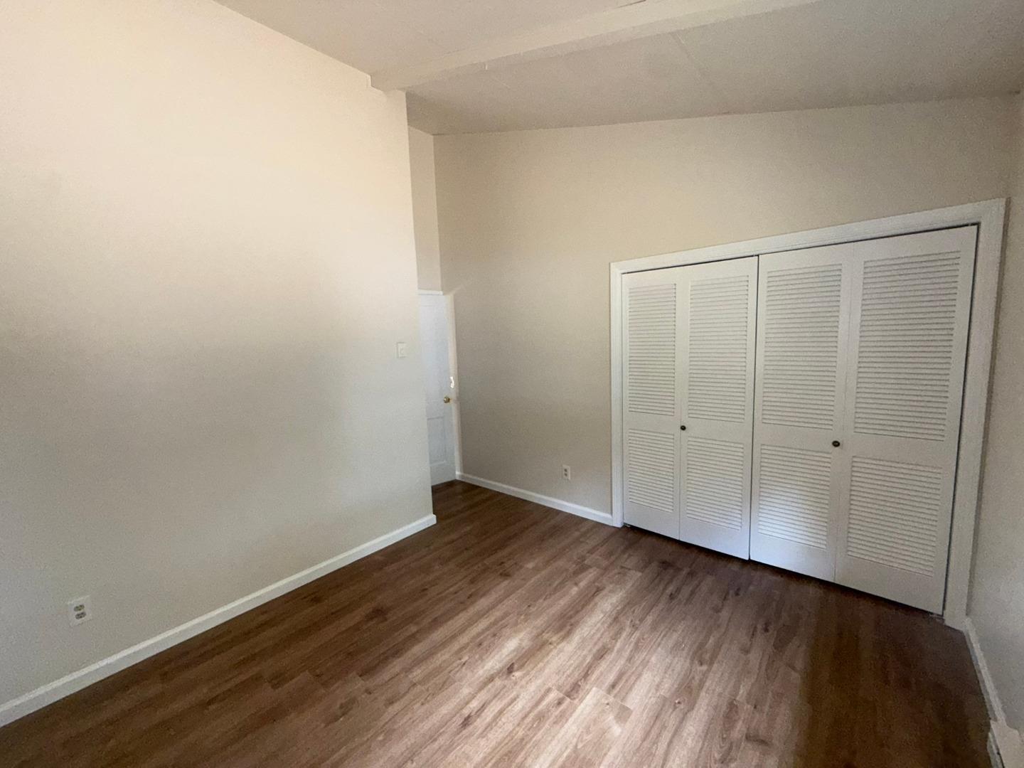 11585 McCarthy Road Carmel Valley, CA 93924 - Photo 34 of 52 a view of an empty room with wooden floor