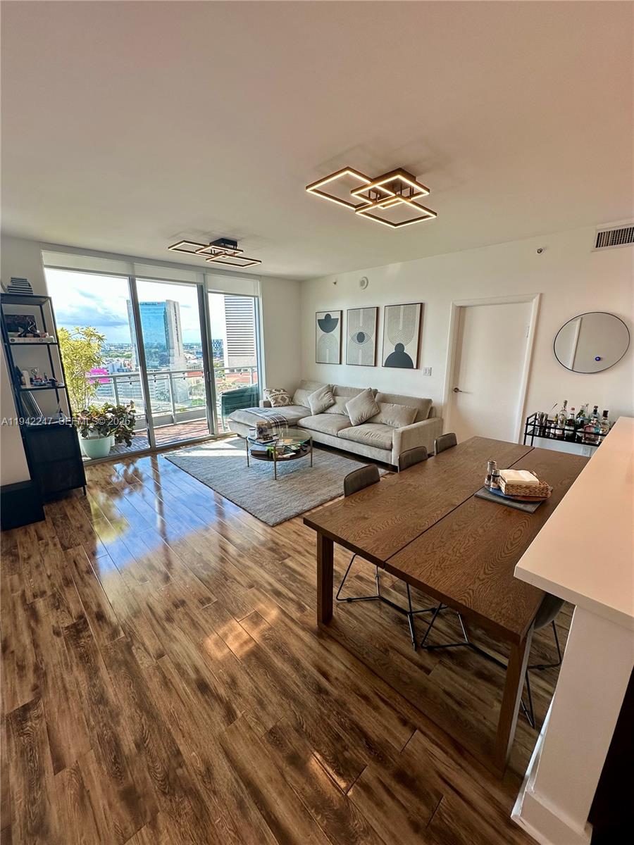 a living room with furniture and a table