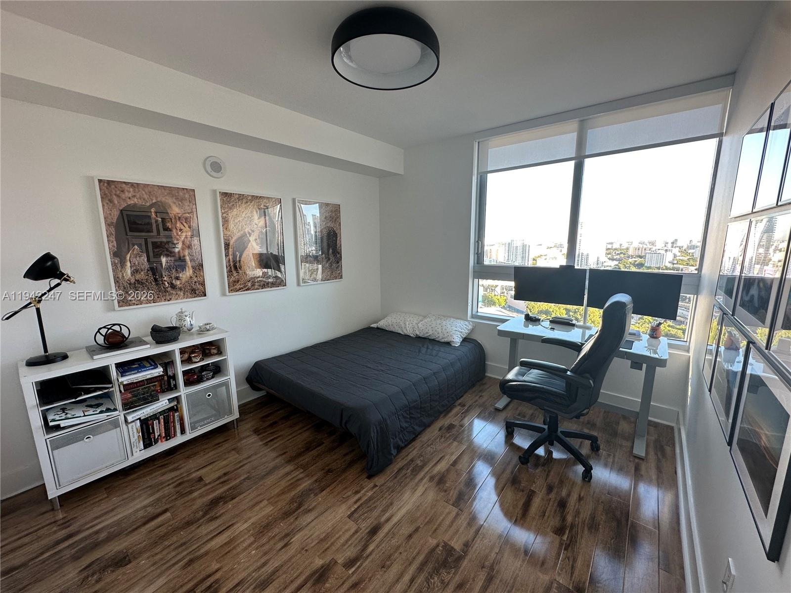 90 Southwest 3rd Street, Unit 2306 Miami, FL 33130 - Photo 13 of 29 a living room with furniture a dining table and a large window