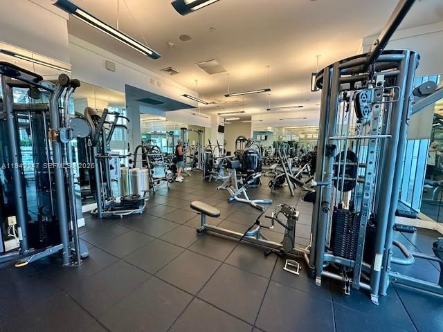 90 Southwest 3rd Street, Unit 2306 Miami, FL 33130 - Photo 25 of 29 a view of a room with gym equipment