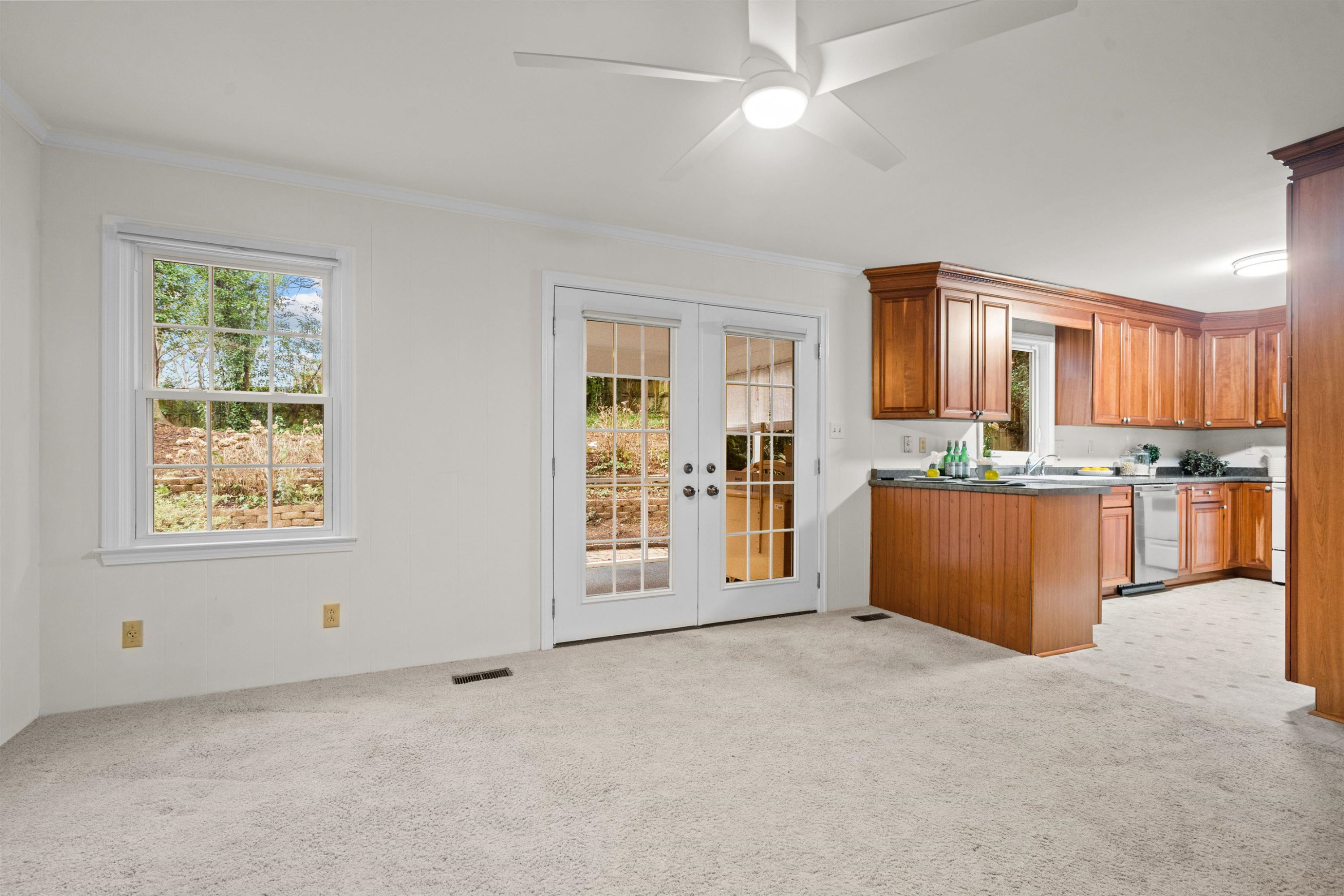 309 Glen Valley Road Raleigh, NC 27609 - Photo 16 of 34 French Doors lead to the Screen Porch from the Family Room. Family Room